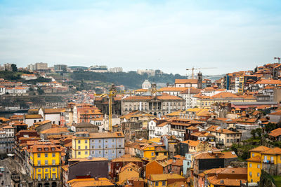 High angle view of town against cloudy sky