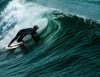 Full length of man surfing in sea