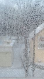 Full frame shot of frozen glass window