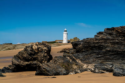 Lighthouse against clear blue sky