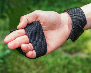 Hand with fixing stable position for sports with sports simulators close-up on a summer day