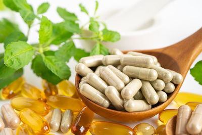 Close-up of pills in bowl on table