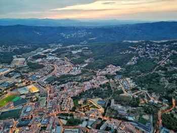 Aerial view of townscape against sky during sunset