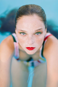 Portrait of young woman in swimming pool