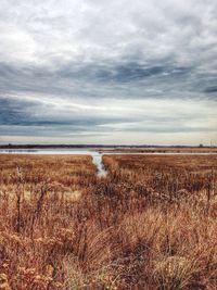 Scenic view of sea against cloudy sky