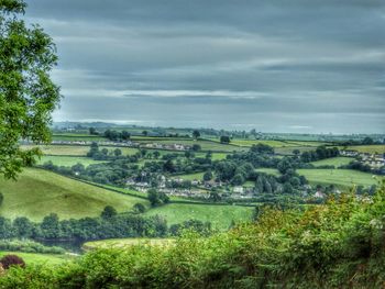 Scenic view of landscape against cloudy sky