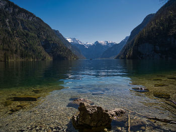 Scenic view of lake and mountains against sky