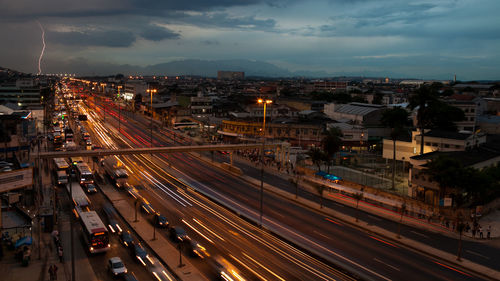 High angle view of light trails on road in city