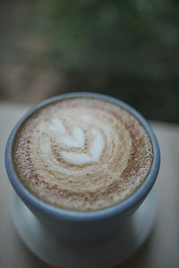 Close-up of cappuccino on table