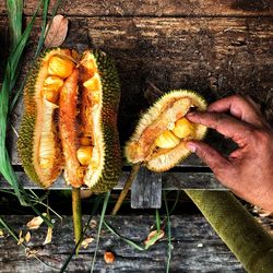High angle view of man preparing food on barbecue grill