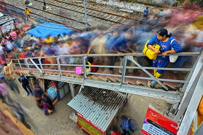 Lonely in the busy world. people motion in a railway platform in kolkata, india.