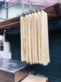 Noodles hanging on rod