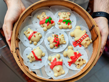 Christmas bread bears in a bamboo steamer.