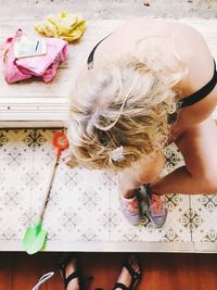 High angle view of girl on table at home