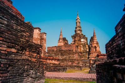 Low angle view of old building against clear sky