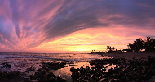 Scenic view of beach against sky during sunset