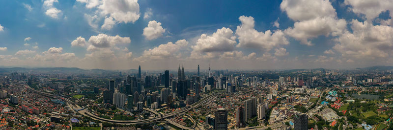 Aerial panorama view kuala lumpur cityscape from drone angle, malaysia.