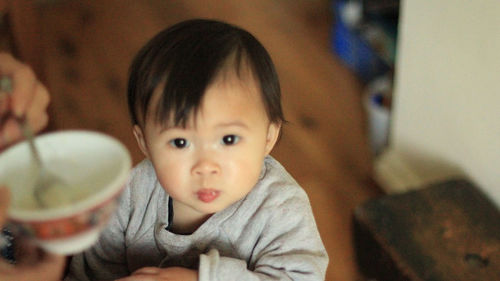 Portrait of cute baby at home