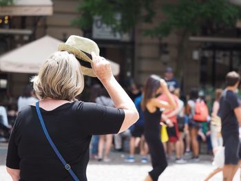 Rear view of man and woman outdoors