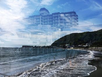 Digital composite image of beach and sea against sky