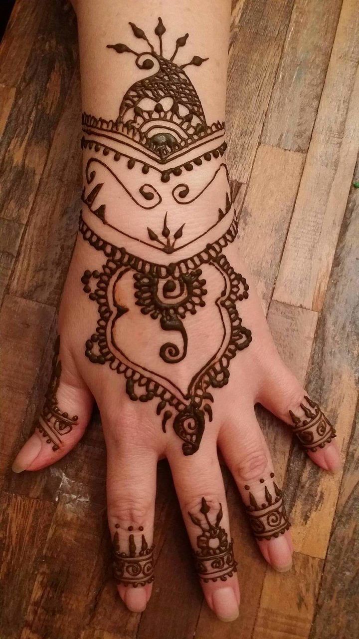 tattoo, indoors, art, art and craft, design, wall - building feature, creativity, high angle view, person, lifestyles, culture, sex symbol, human skin, representation