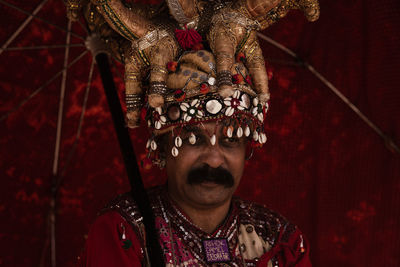 Close-up portrait of man wearing mask