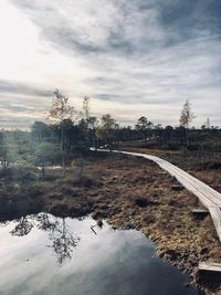 Scenic view of railroad tracks against sky