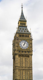 Low angle view of clock tower against sky