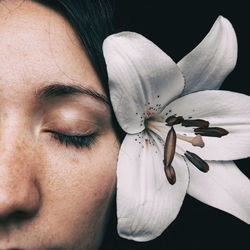 Close-up of woman wearing flower