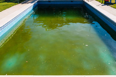 High angle view of swimming pool in pond