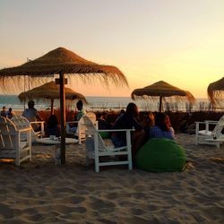 Chairs and thatched roof at beach