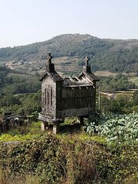 Built structure on field against clear sky