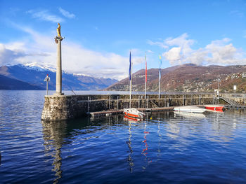 Landscape of the lake maggiore and the old harbor of luino