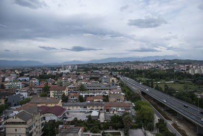 High angle view of road amidst buildings in city