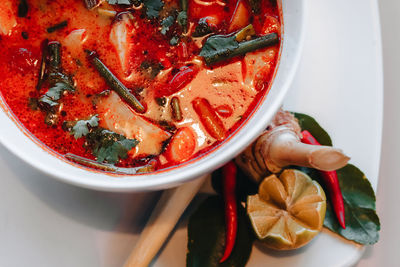Tom yum kung spicy thai soup with shrimp lime and red chilli