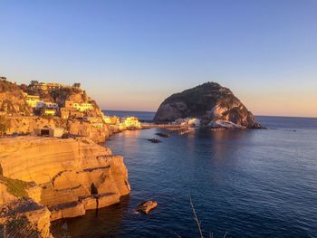 Scenic view of sea against clear sky during sunset