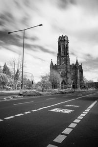 Road against cloudy sky