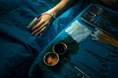 High angle view of woman holding coffee cup