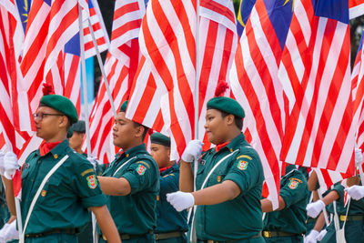 Full length of young man standing in flags