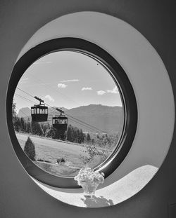 Close-up of side-view mirror against clear sky