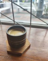 High angle view of coffee cup on table