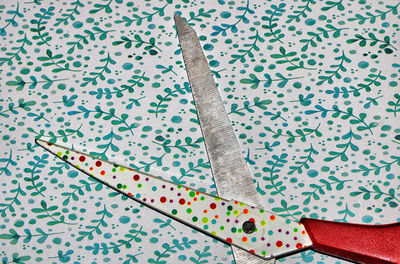 High angle view of multi colored pencils on paper