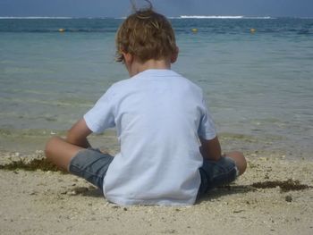 Rear view of woman looking at sea