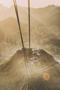 High angle view of buildings in city against sky during sunset