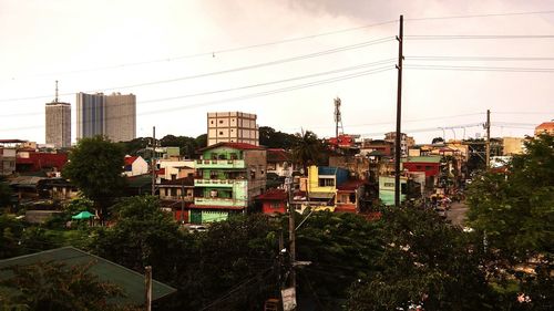 Buildings in city against sky