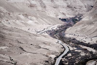 High angle view of tire tracks on road