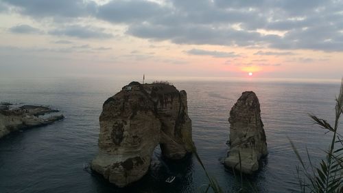 Scenic view of sea against sky at sunset