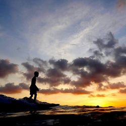 Scenic view of sea at sunset