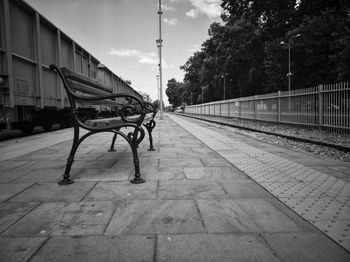 View of empty railroad tracks against sky