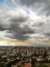 High angle view of buildings in city against sky